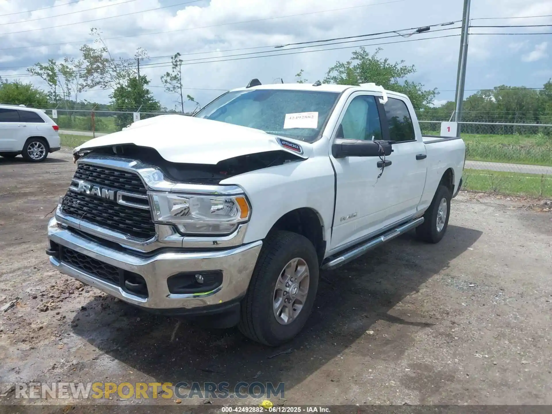 2 Photograph of a damaged car 3C6UR5DJ9RG364926 RAM 2500 2024