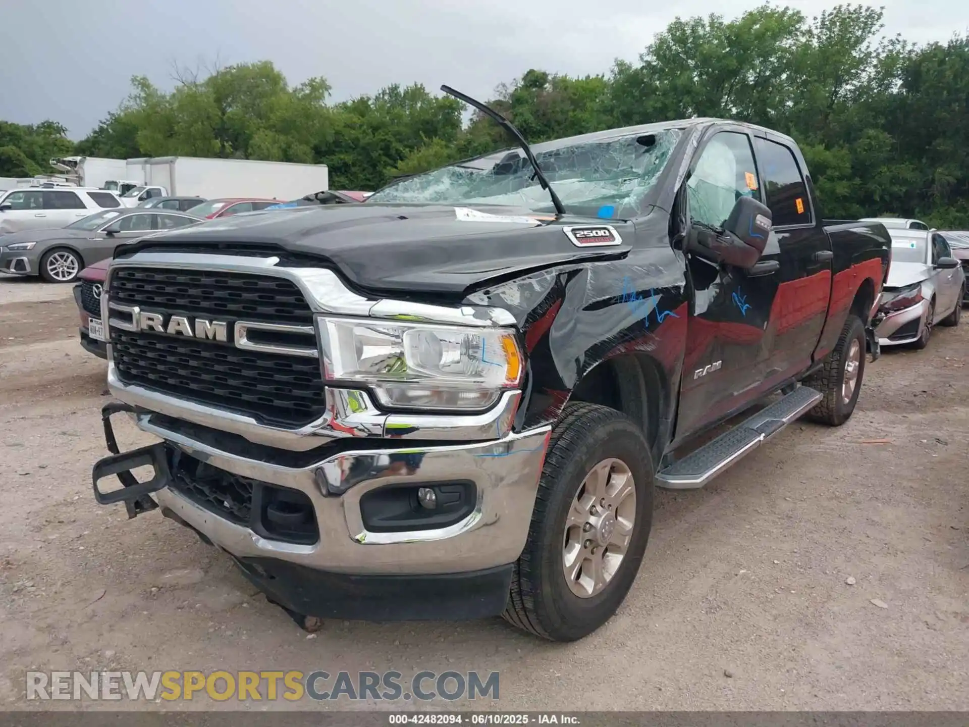 2 Photograph of a damaged car 3C6UR5DJ9RG365218 RAM 2500 2024