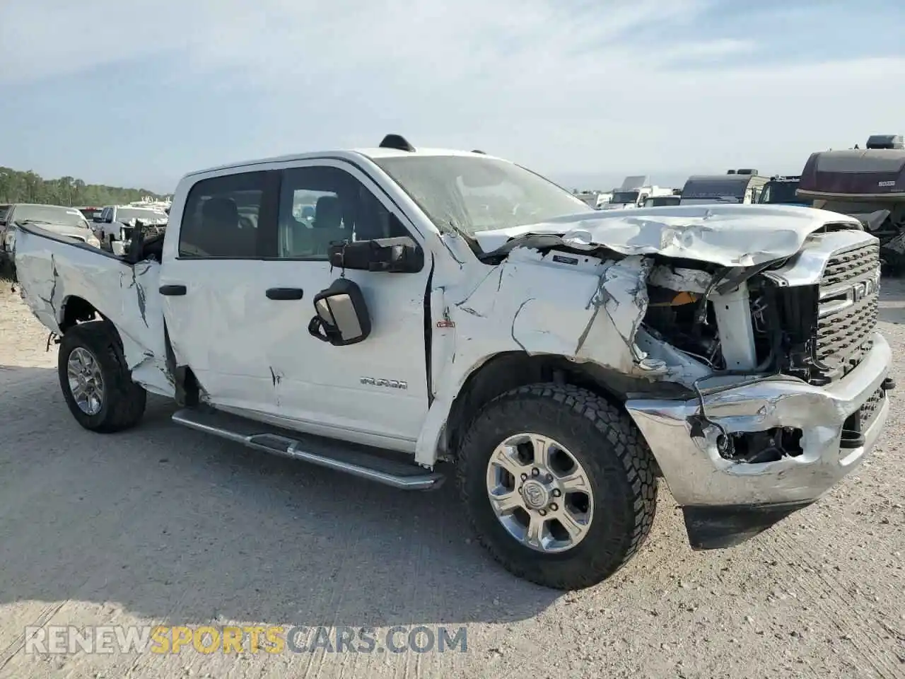 1 Photograph of a damaged car 3C6UR5DL0RG176975 RAM 2500 2024