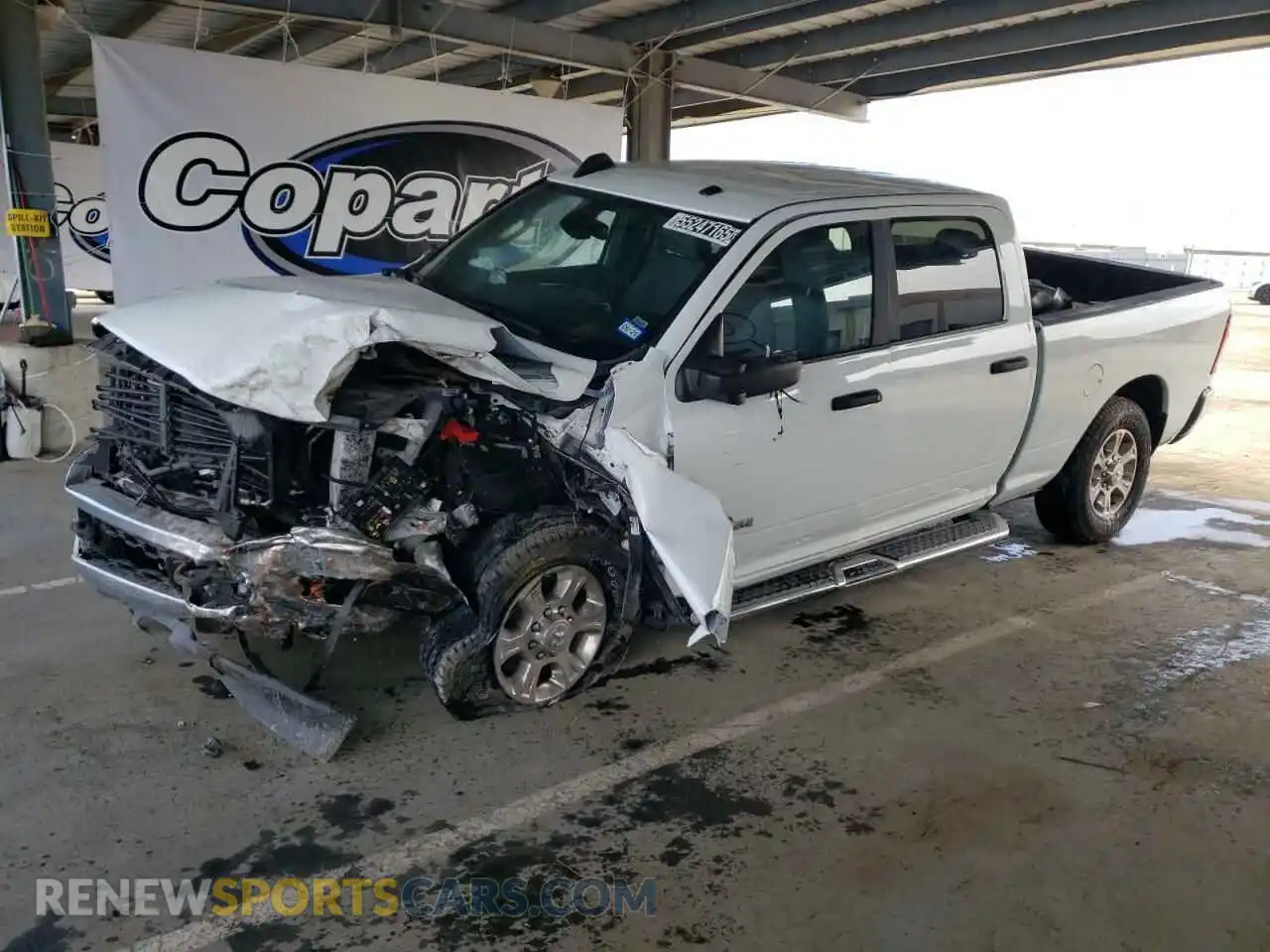 1 Photograph of a damaged car 3C6UR5DL0RG336465 RAM 2500 2024