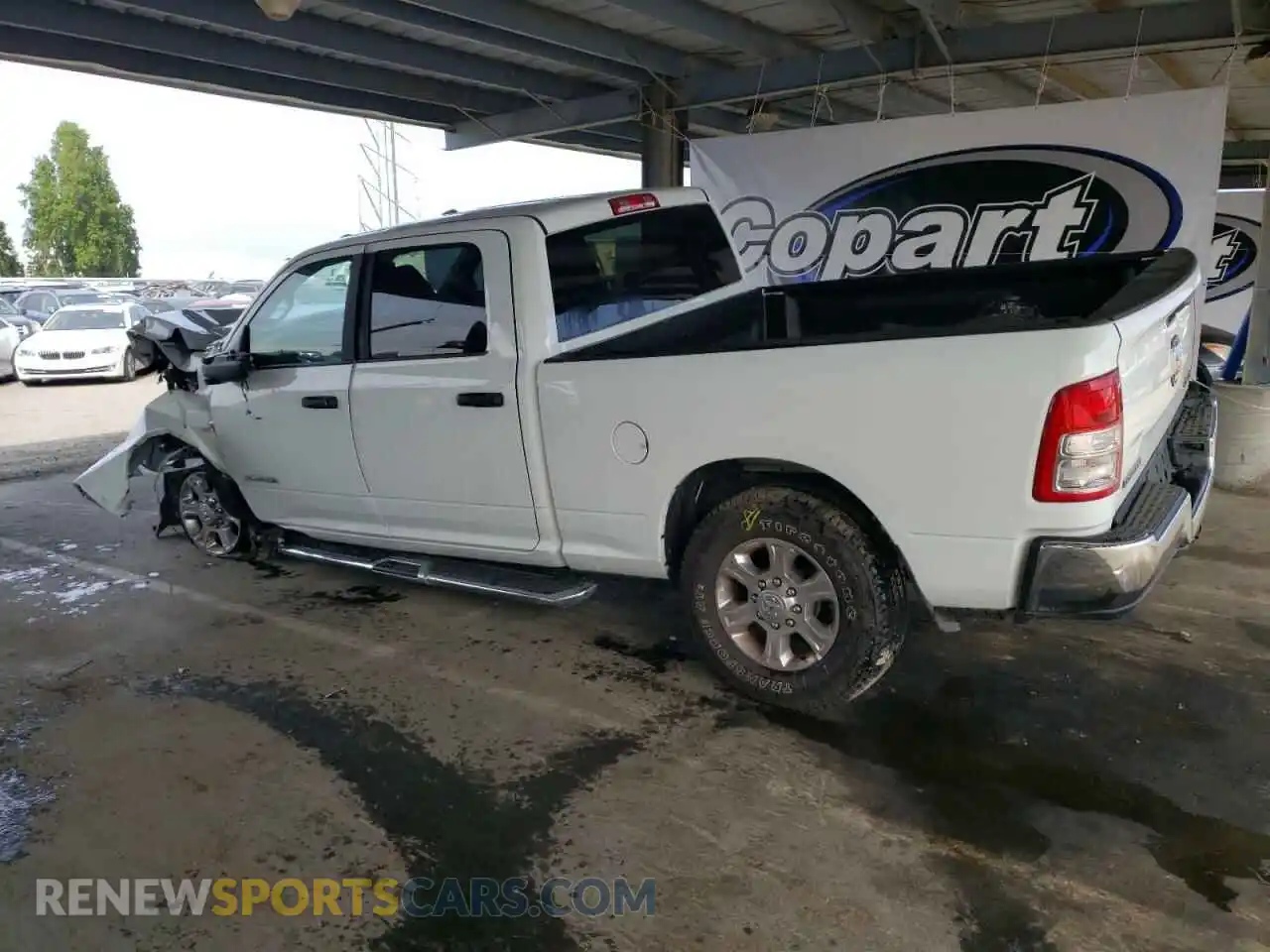 2 Photograph of a damaged car 3C6UR5DL0RG336465 RAM 2500 2024