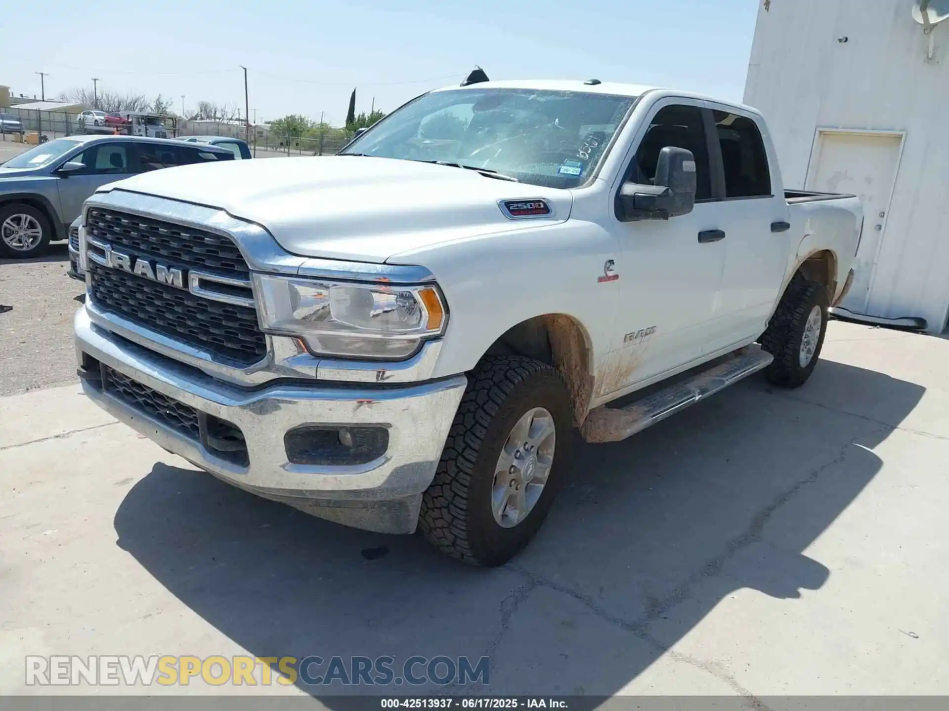 2 Photograph of a damaged car 3C6UR5DL2RG339979 RAM 2500 2024