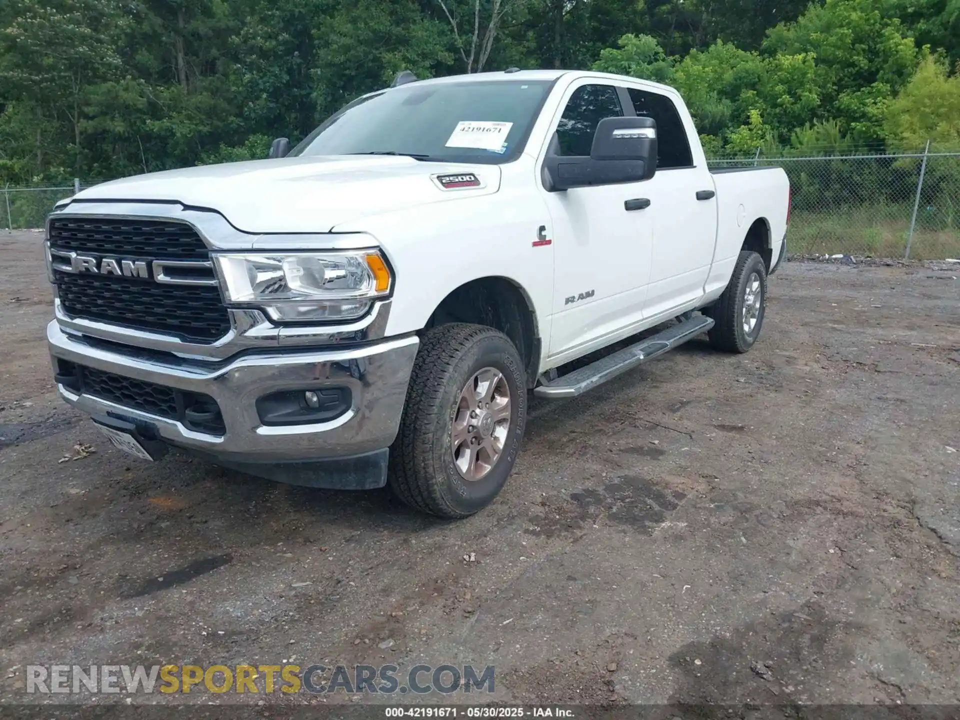 2 Photograph of a damaged car 3C6UR5DL2RG340744 RAM 2500 2024