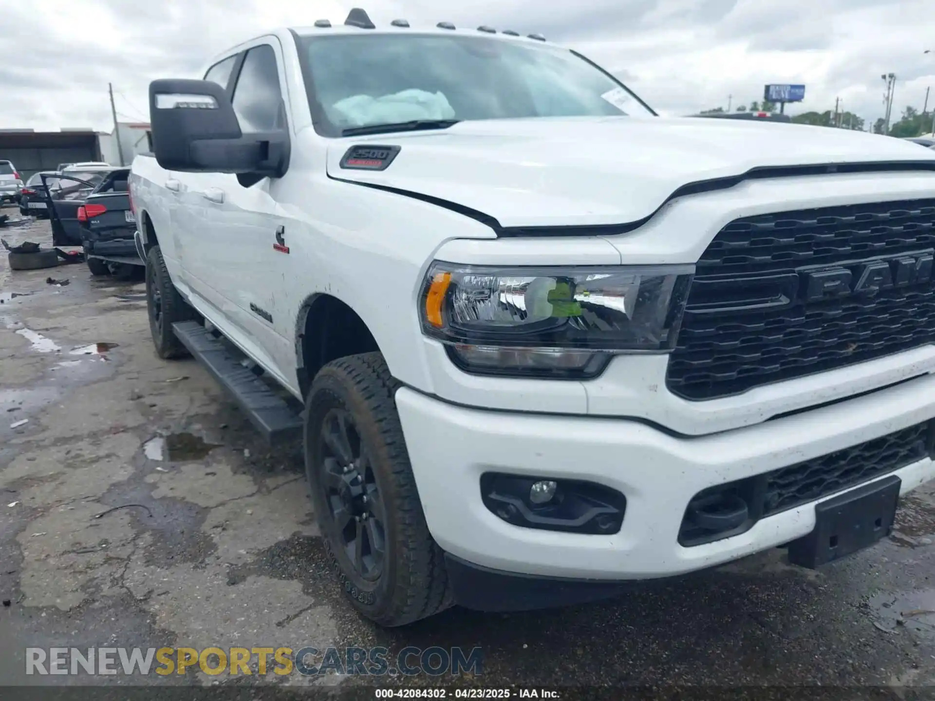 1 Photograph of a damaged car 3C6UR5DL2RG378362 RAM 2500 2024