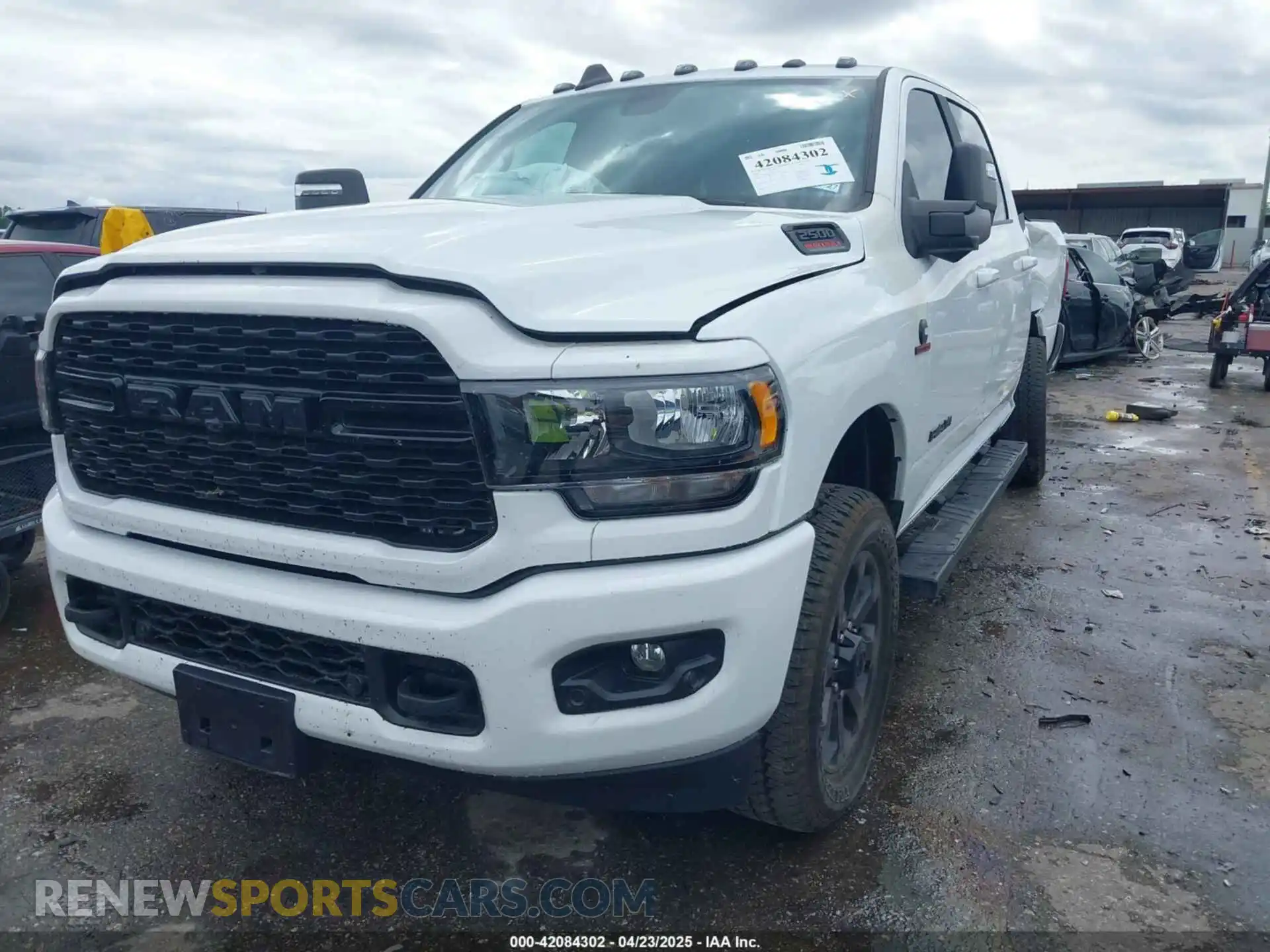 2 Photograph of a damaged car 3C6UR5DL2RG378362 RAM 2500 2024