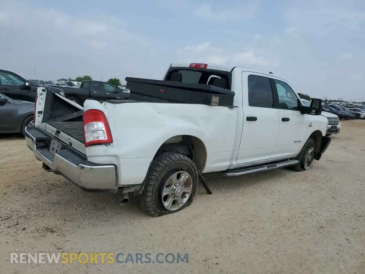 3 Photograph of a damaged car 3C6UR5DL3RG176923 RAM 2500 2024