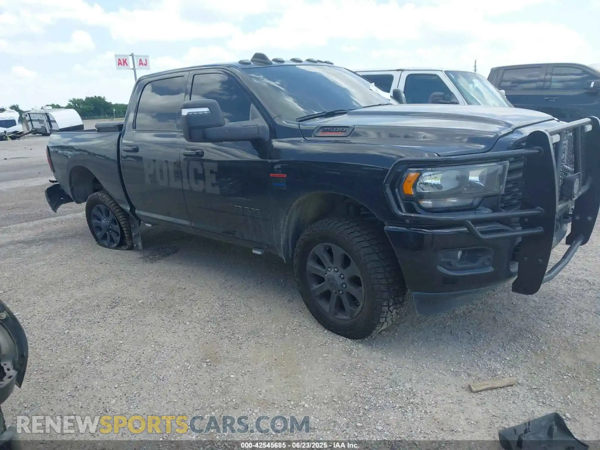 1 Photograph of a damaged car 3C6UR5DL3RG221262 RAM 2500 2024