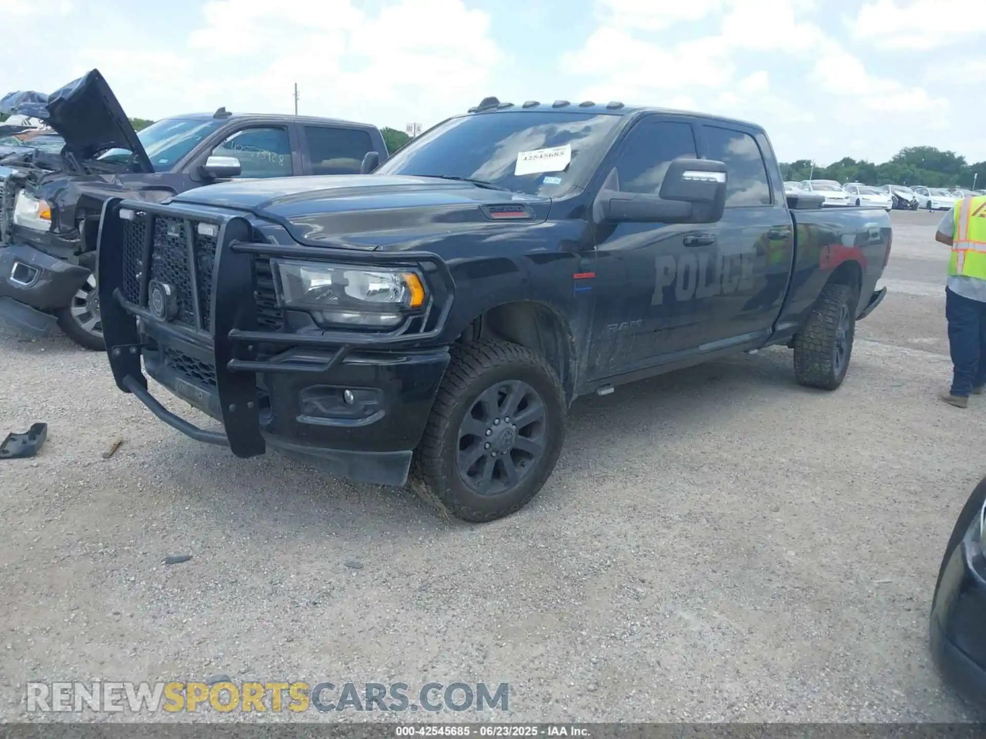 2 Photograph of a damaged car 3C6UR5DL3RG221262 RAM 2500 2024