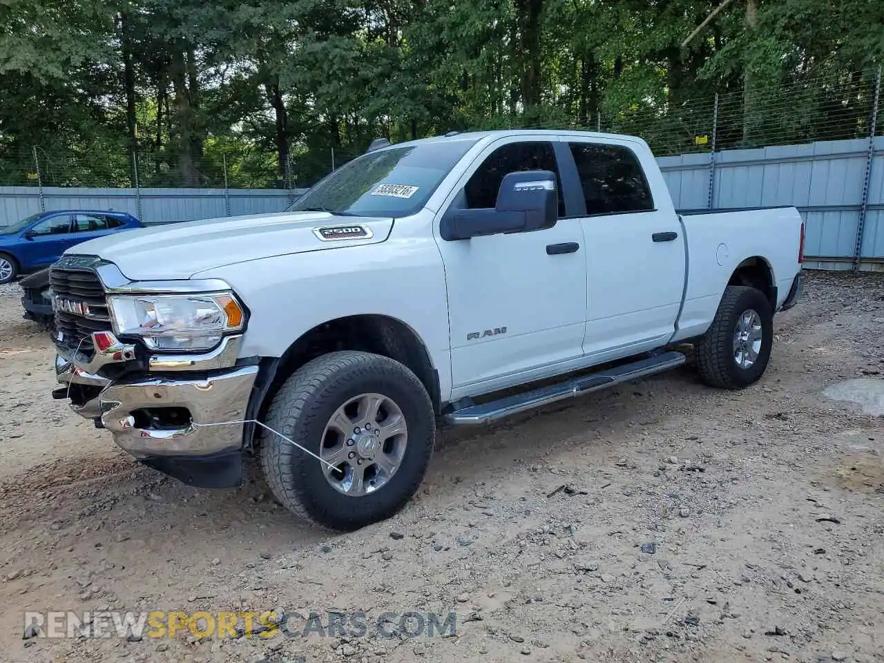 1 Photograph of a damaged car 3C6UR5DL4RG285794 RAM 2500 2024