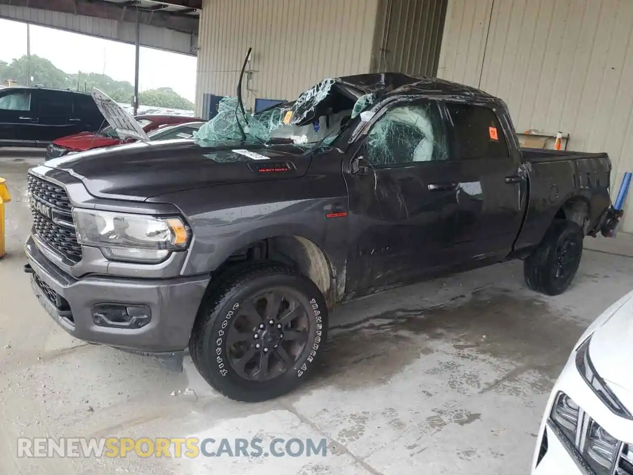 1 Photograph of a damaged car 3C6UR5DL5RG118652 RAM 2500 2024