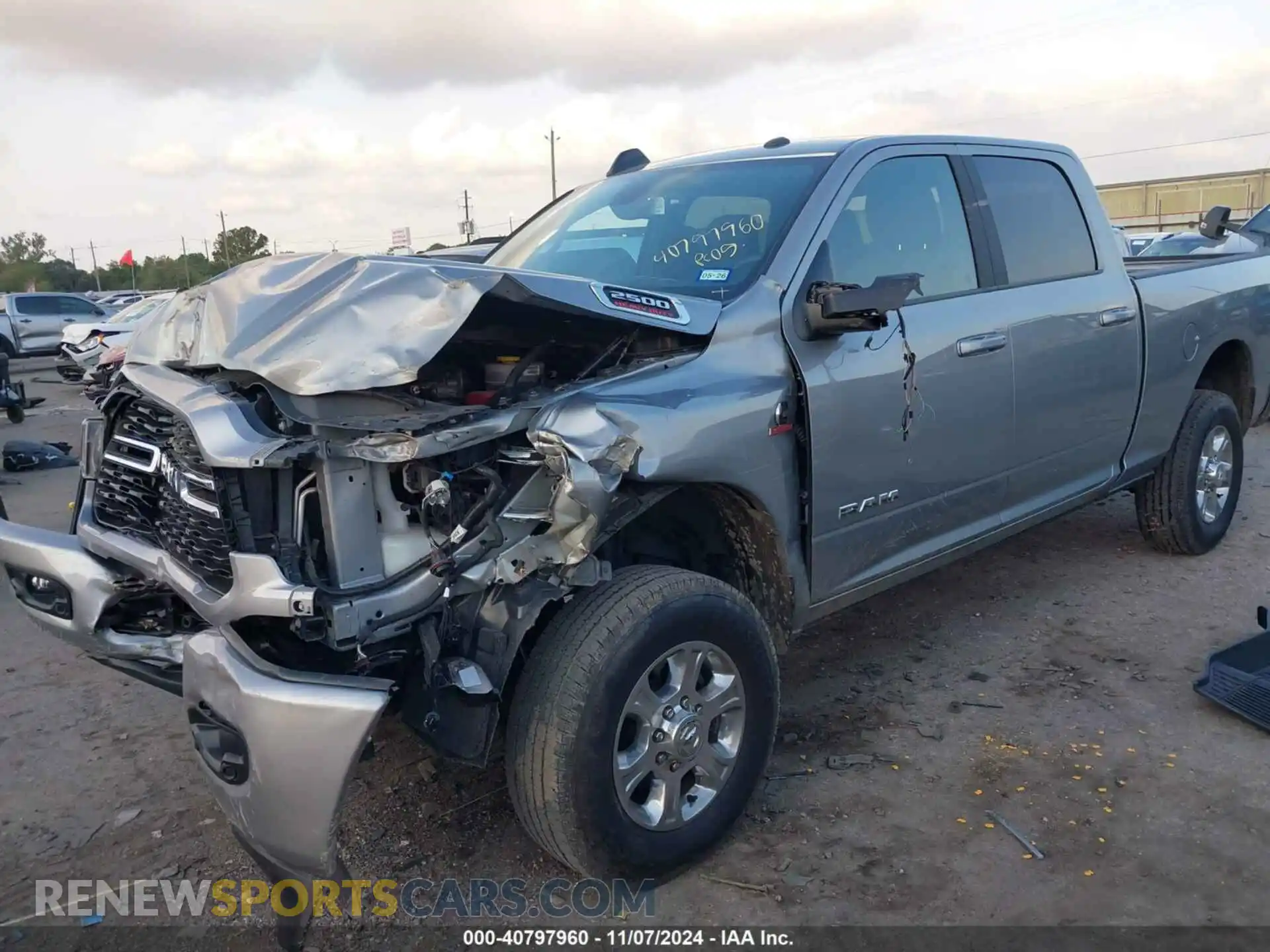 2 Photograph of a damaged car 3C6UR5DL5RG244946 RAM 2500 2024