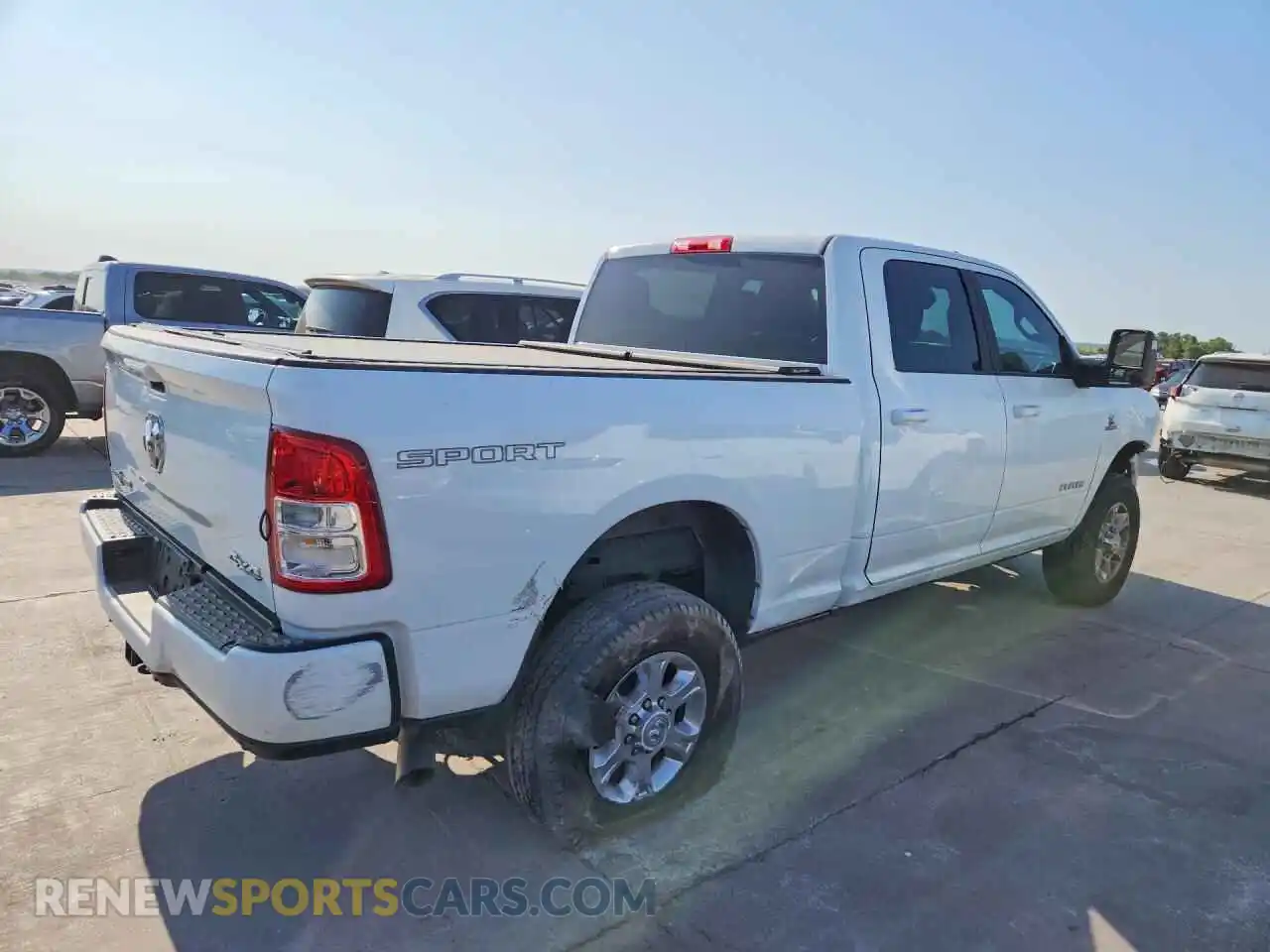 3 Photograph of a damaged car 3C6UR5DL6RG144757 RAM 2500 2024