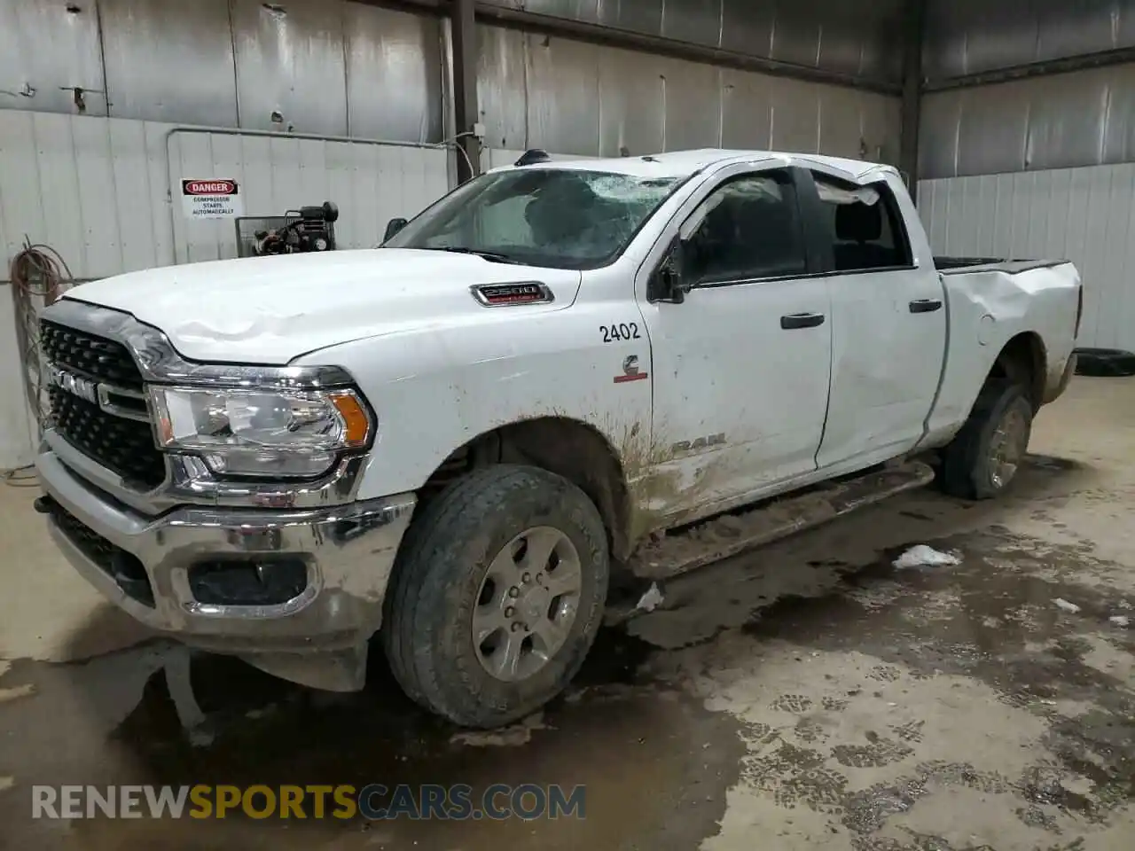 1 Photograph of a damaged car 3C6UR5DL7RG195121 RAM 2500 2024