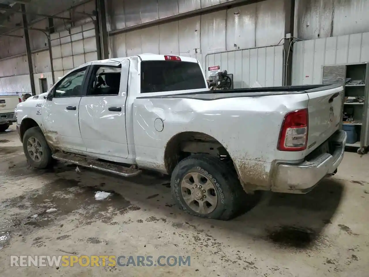 2 Photograph of a damaged car 3C6UR5DL7RG195121 RAM 2500 2024