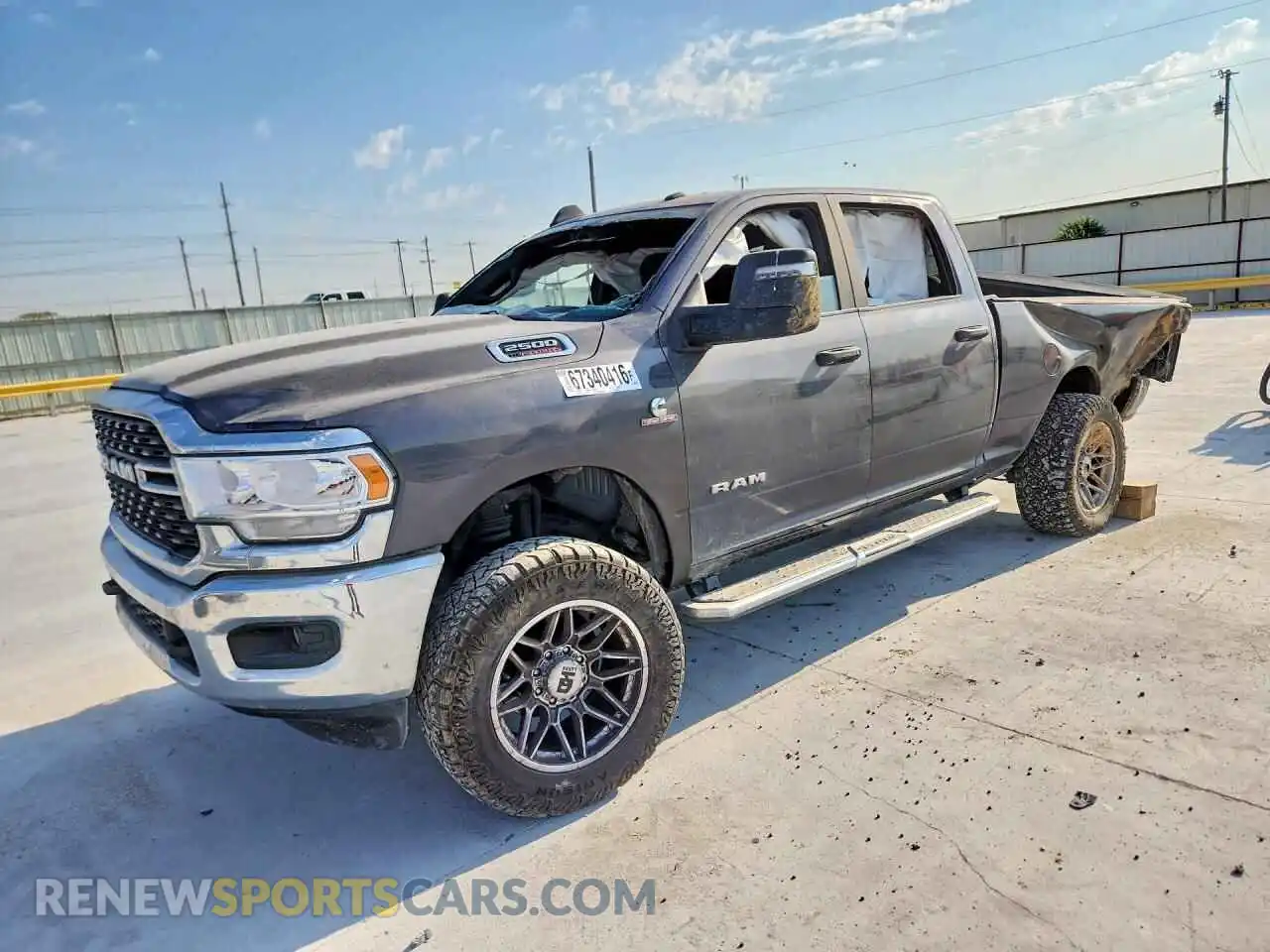 1 Photograph of a damaged car 3C6UR5DL7RG244852 RAM 2500 2024