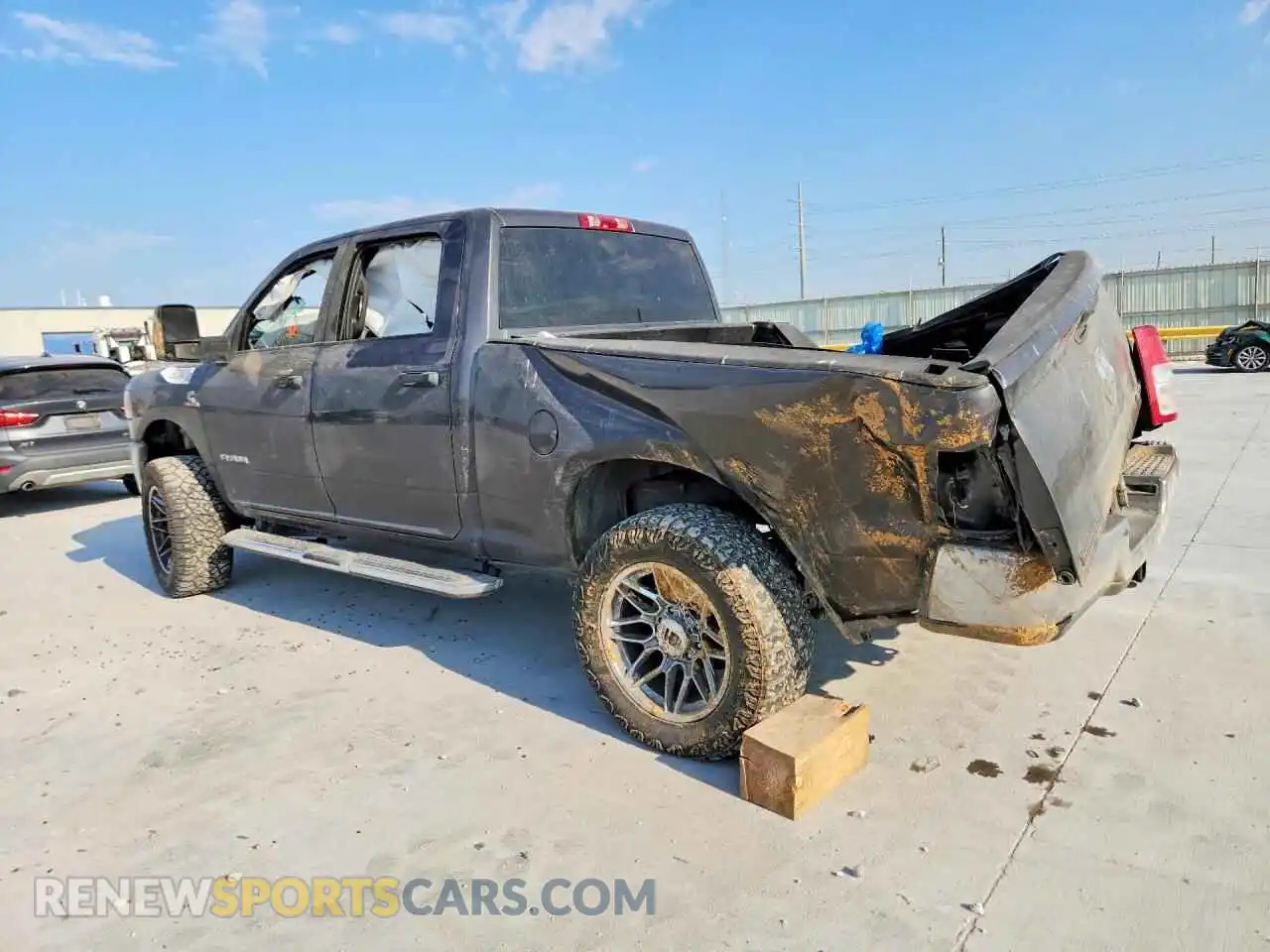 2 Photograph of a damaged car 3C6UR5DL7RG244852 RAM 2500 2024