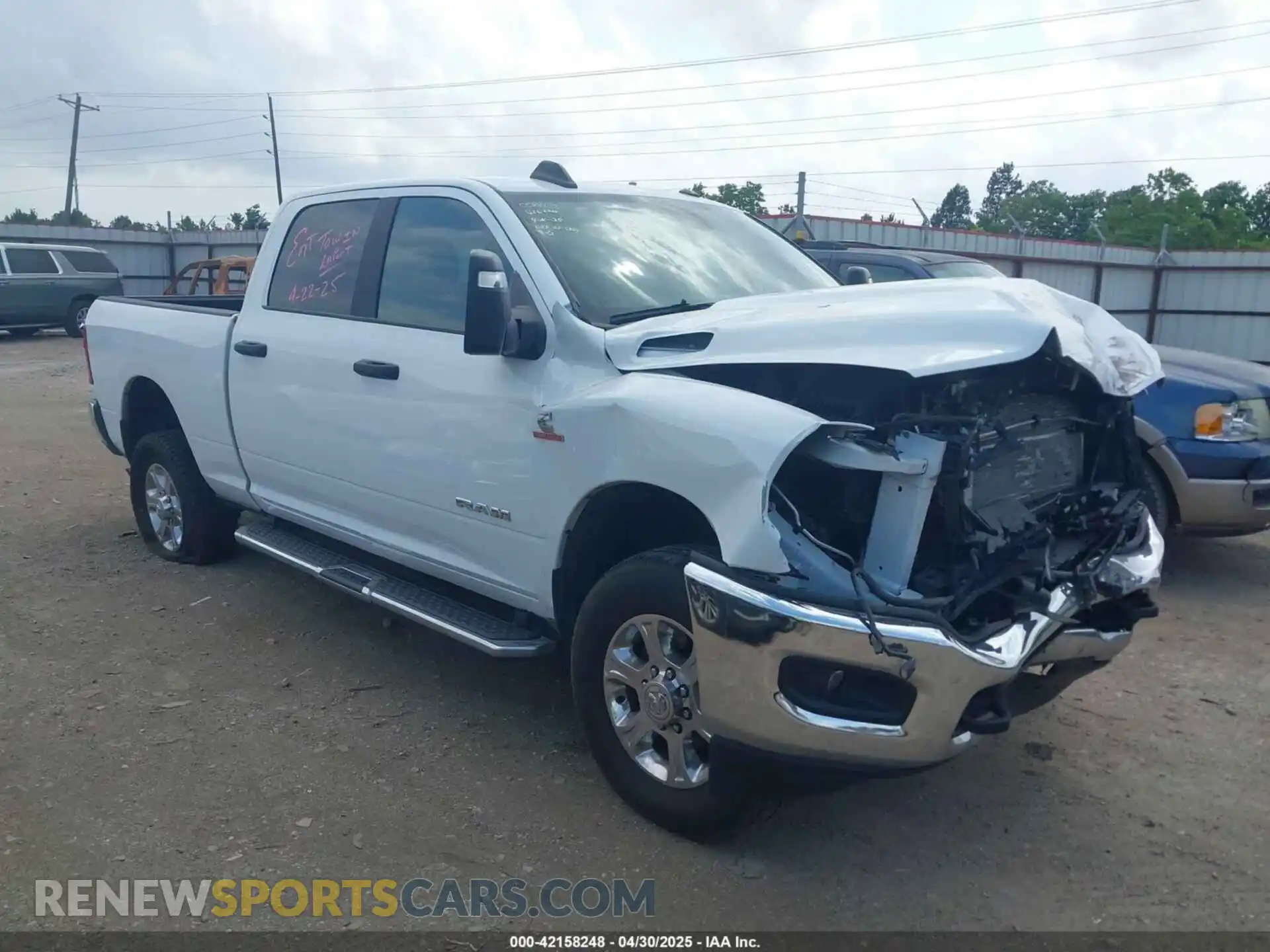1 Photograph of a damaged car 3C6UR5DL8RG266424 RAM 2500 2024