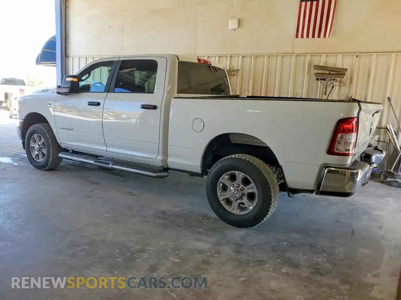 2 Photograph of a damaged car 3C6UR5DL8RG311183 RAM 2500 2024