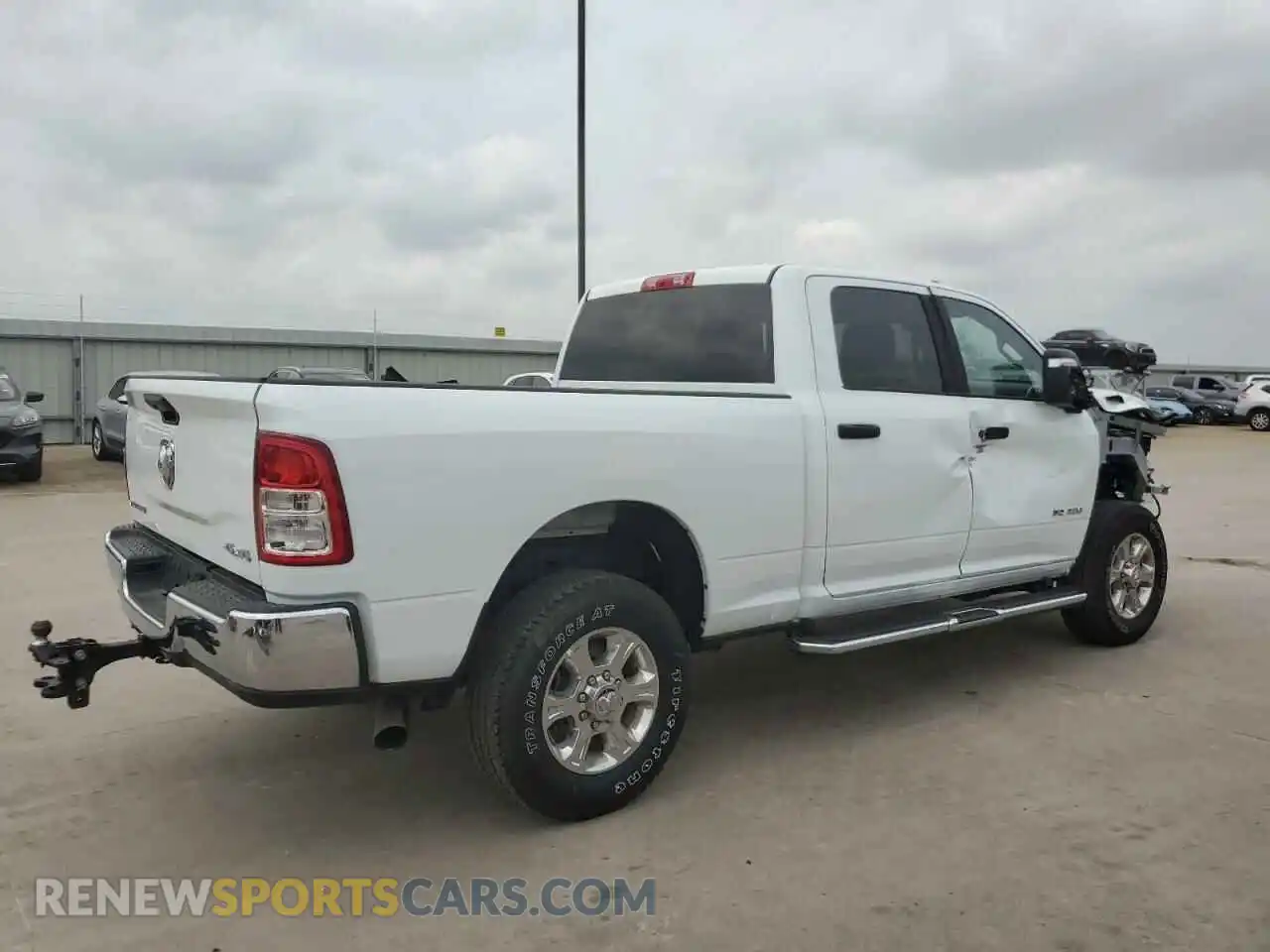 3 Photograph of a damaged car 3C6UR5DL9RG156353 RAM 2500 2024