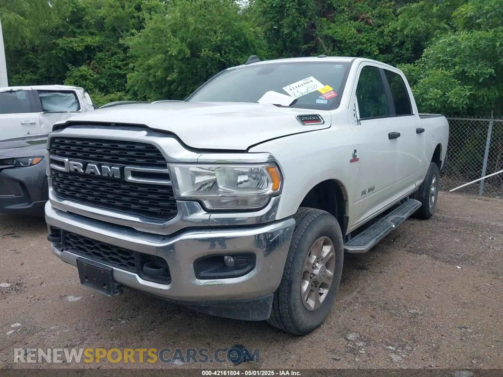 2 Photograph of a damaged car 3C6UR5DL9RG283488 RAM 2500 2024