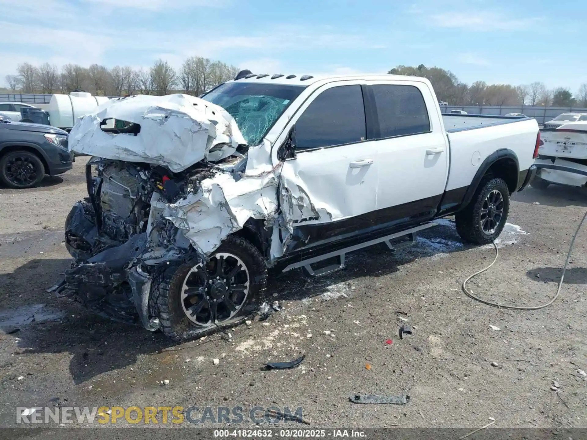 2 Photograph of a damaged car 3C6UR5EJ2RG278405 RAM 2500 2024
