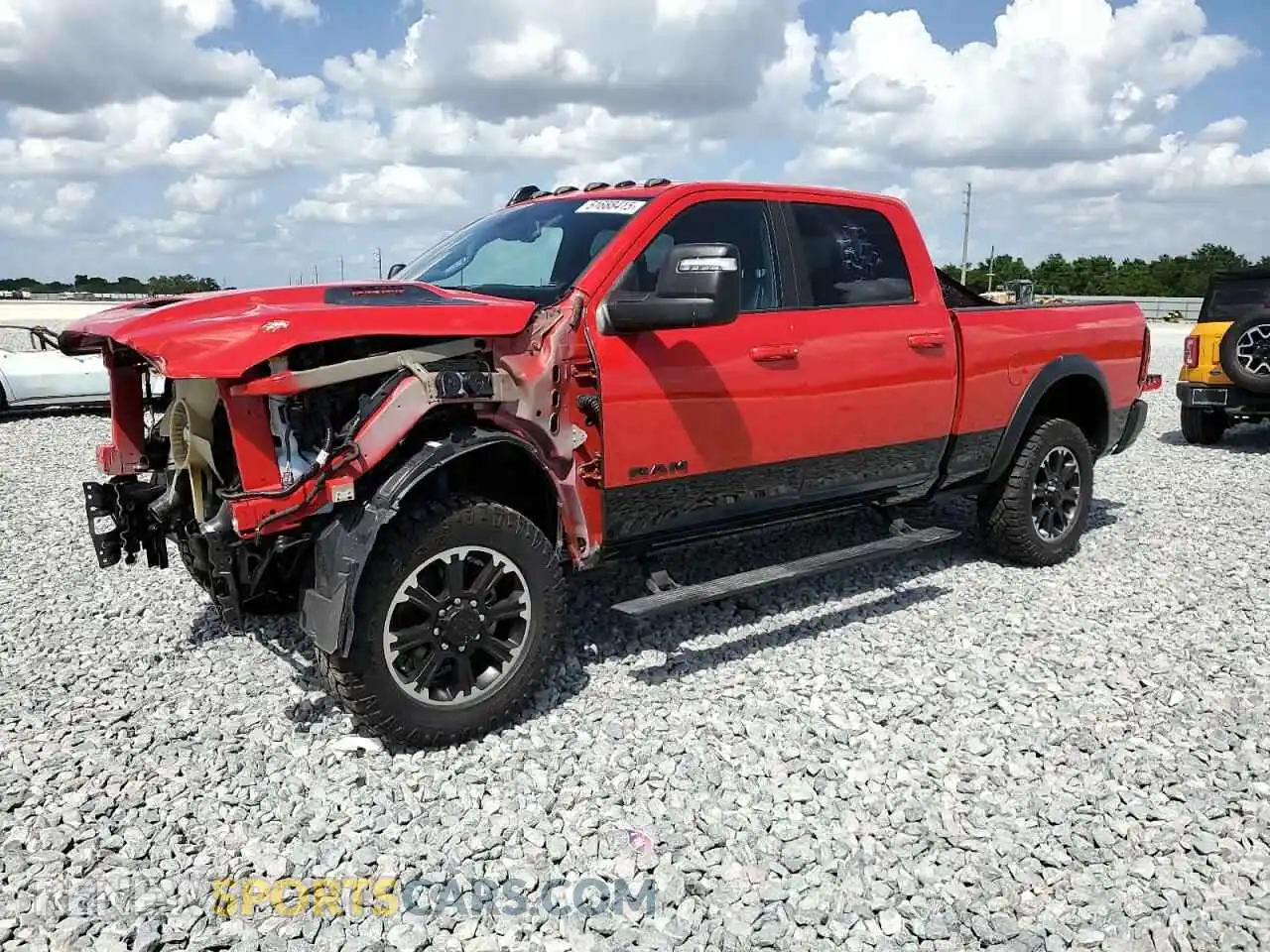 1 Photograph of a damaged car 3C6UR5EL0RG207351 RAM 2500 2024