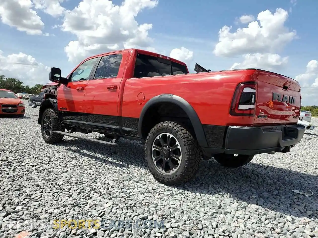 2 Photograph of a damaged car 3C6UR5EL0RG207351 RAM 2500 2024