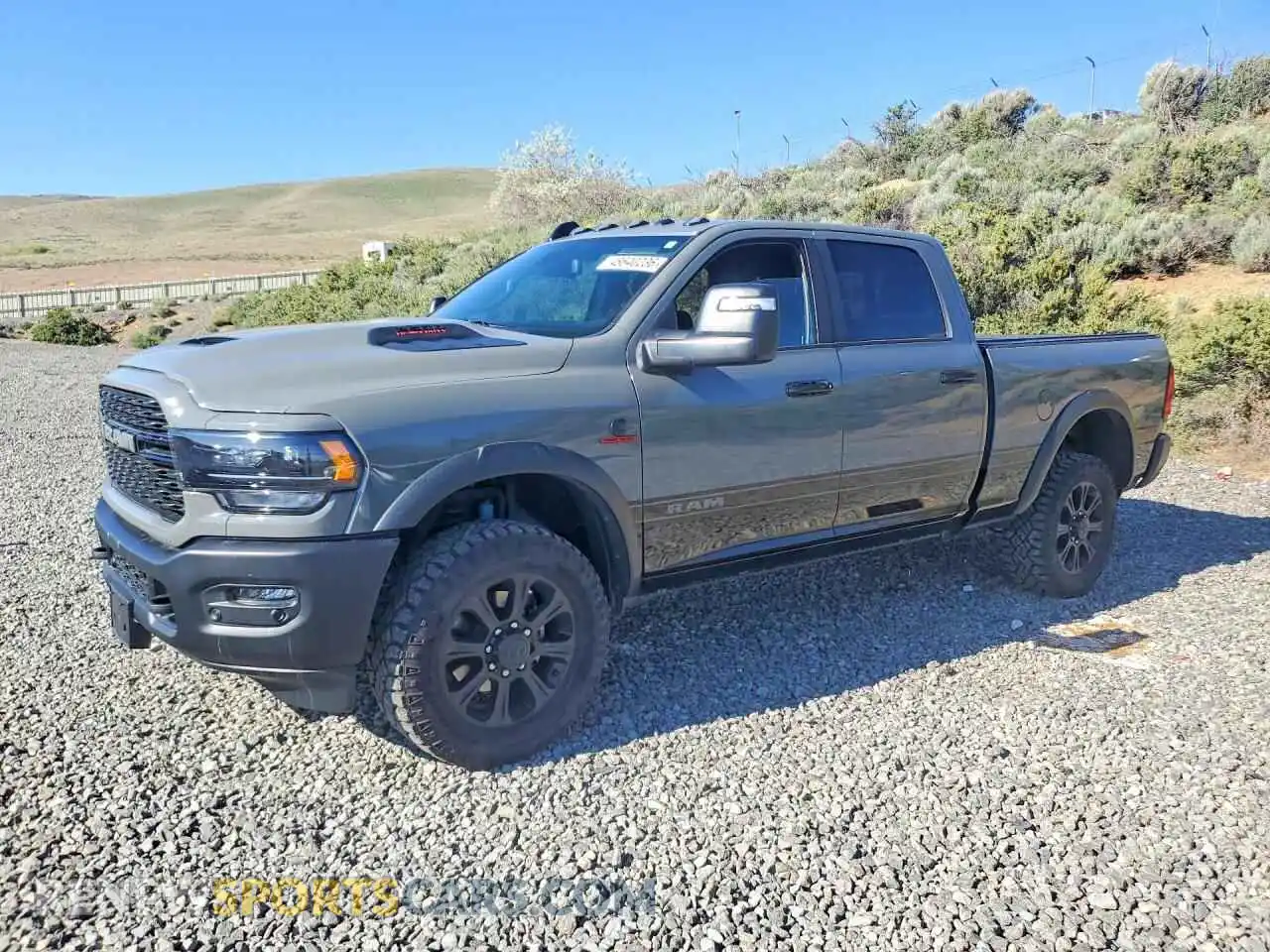 1 Photograph of a damaged car 3C6UR5EL0RG376804 RAM 2500 2024