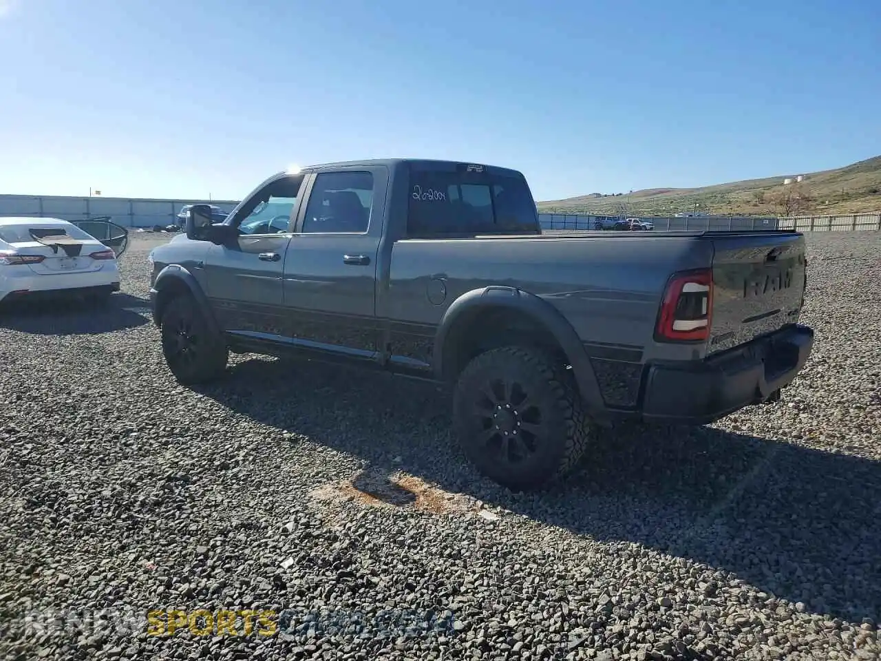 2 Photograph of a damaged car 3C6UR5EL0RG376804 RAM 2500 2024