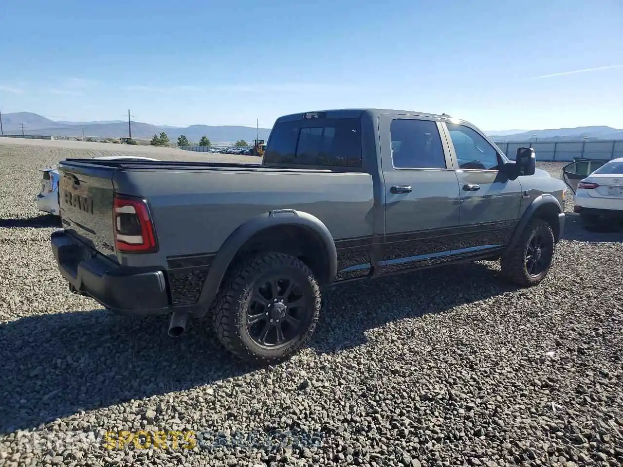 3 Photograph of a damaged car 3C6UR5EL0RG376804 RAM 2500 2024