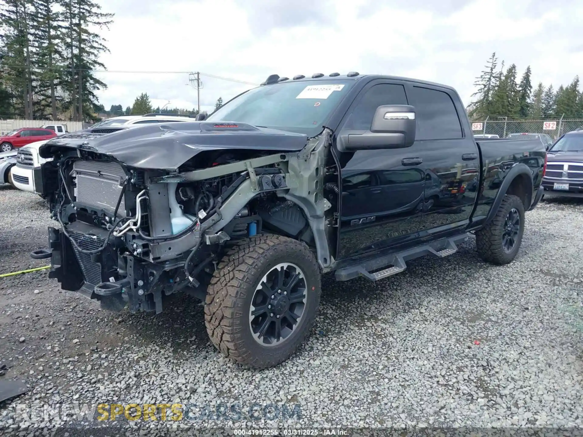 2 Photograph of a damaged car 3C6UR5EL1RG238463 RAM 2500 2024