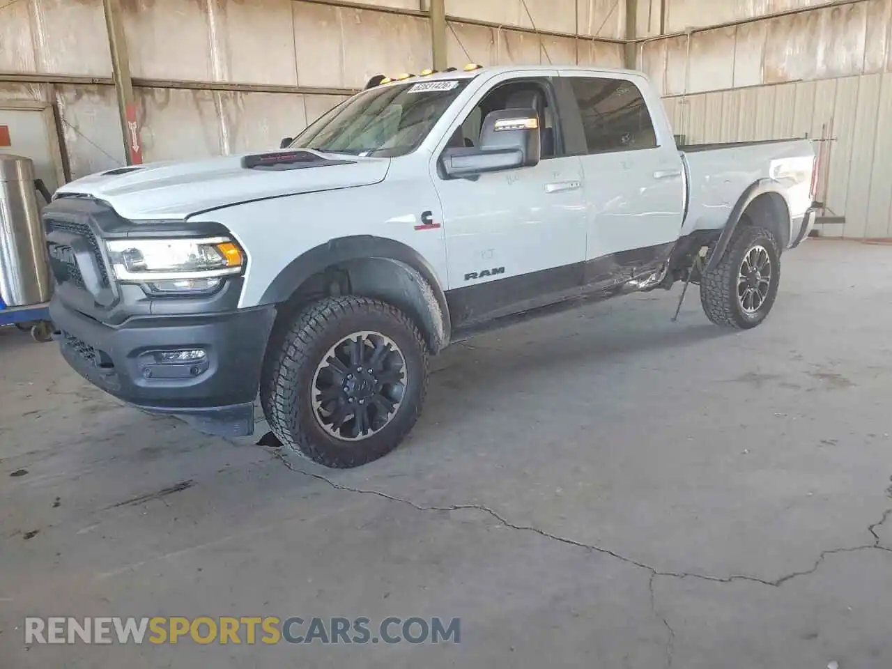 1 Photograph of a damaged car 3C6UR5EL3RG329539 RAM 2500 2024