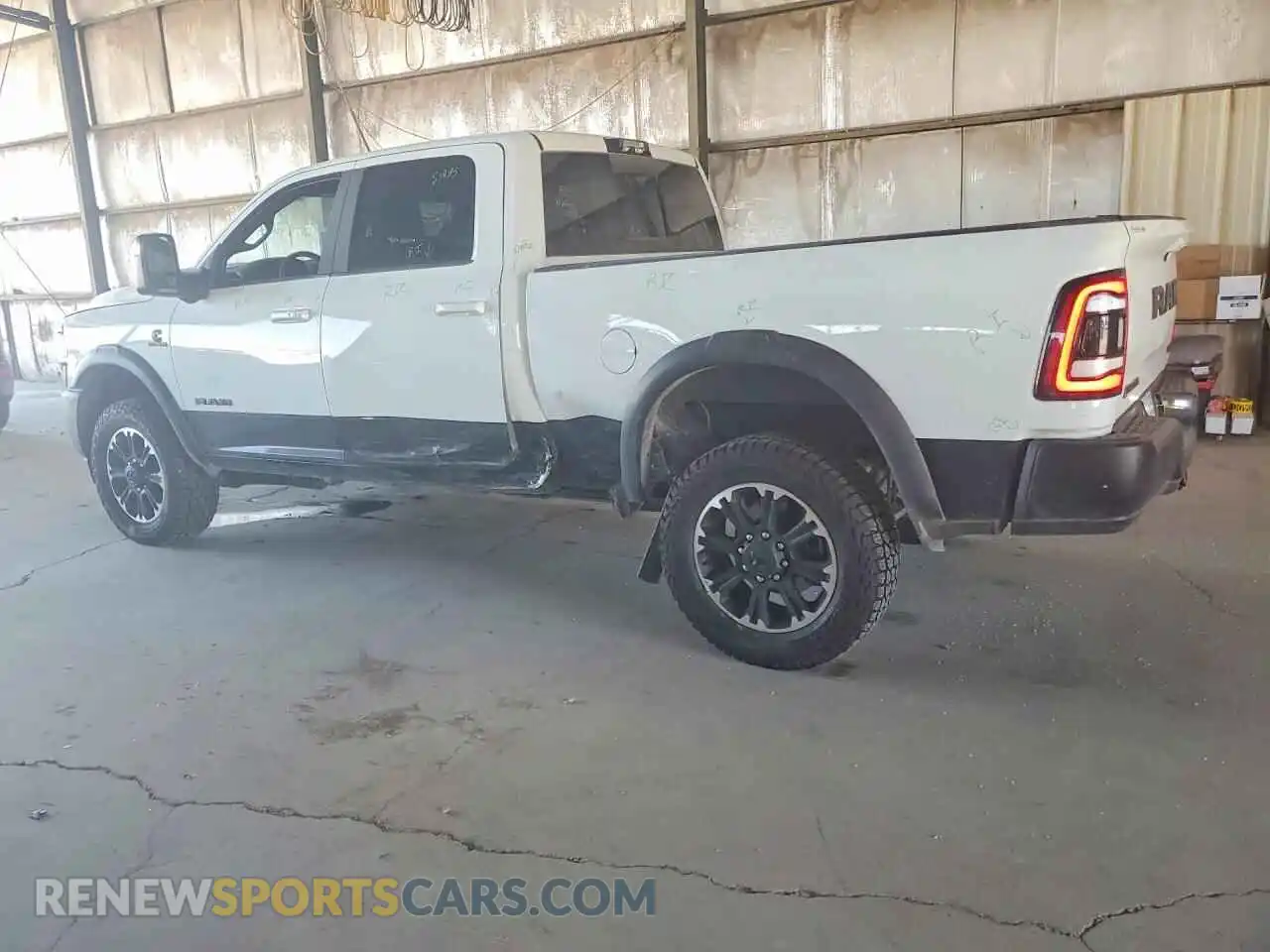 2 Photograph of a damaged car 3C6UR5EL3RG329539 RAM 2500 2024