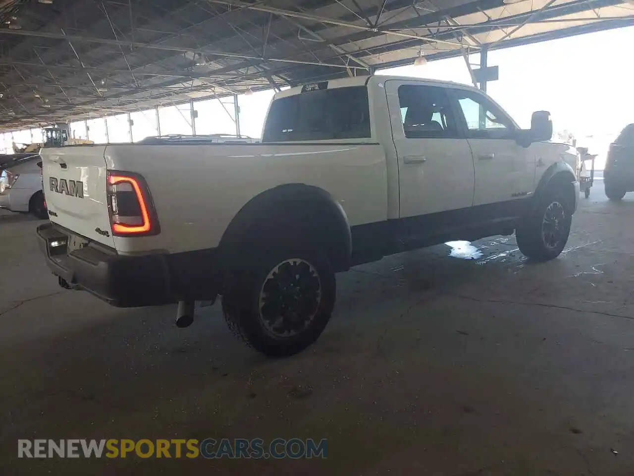 3 Photograph of a damaged car 3C6UR5EL3RG329539 RAM 2500 2024