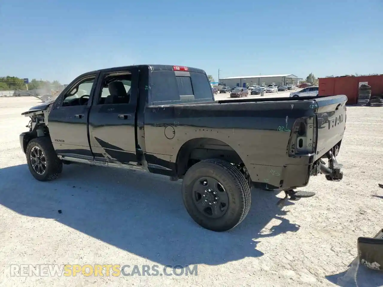 2 Photograph of a damaged car 3C6UR5EL5RG104149 RAM 2500 2024