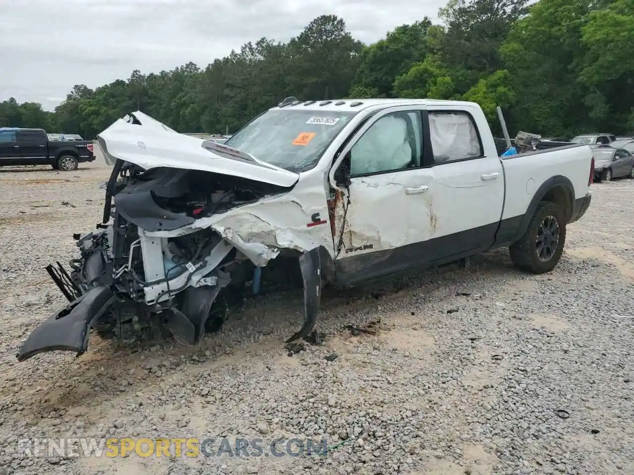 1 Photograph of a damaged car 3C6UR5EL9RG300417 RAM 2500 2024