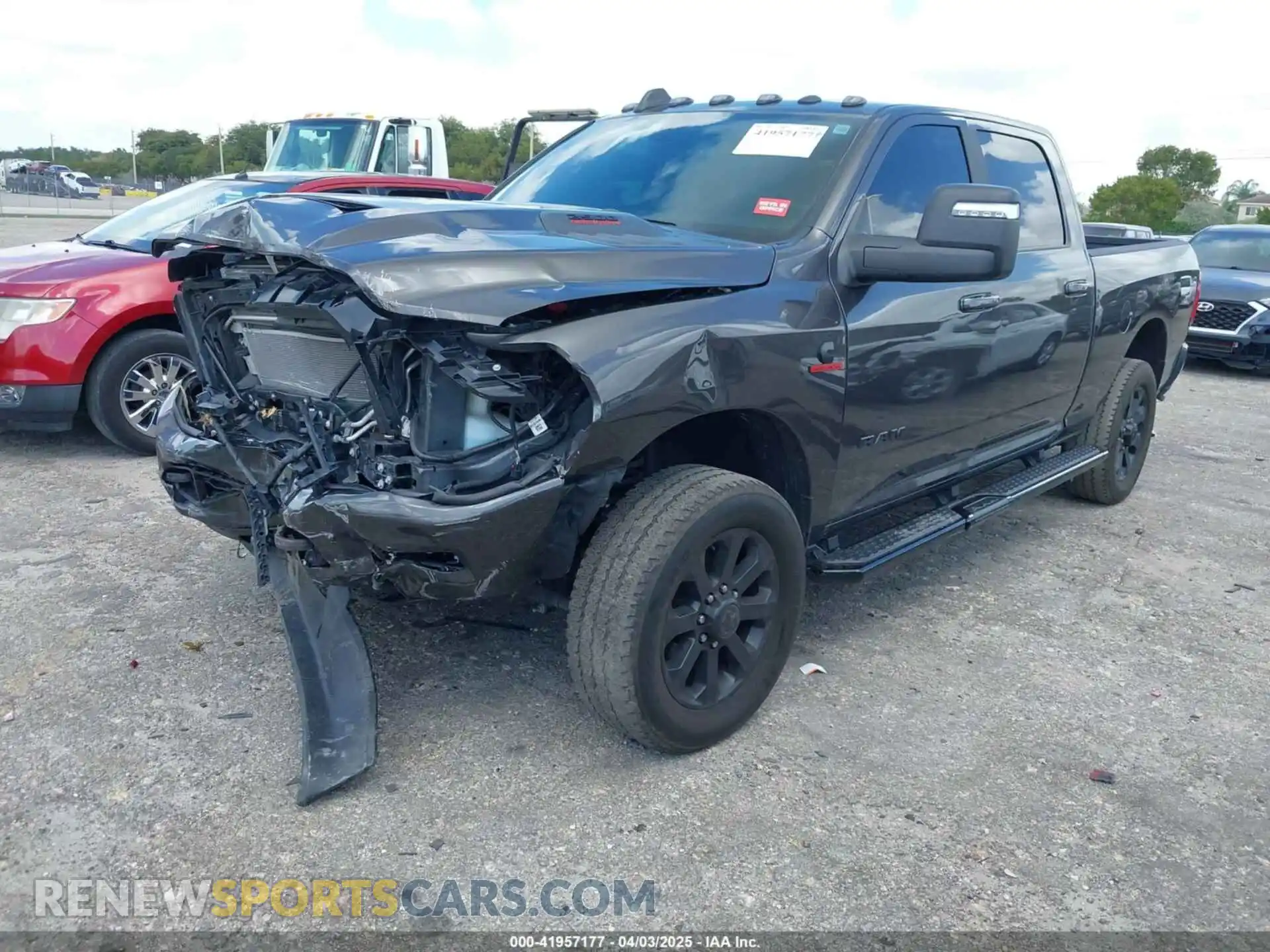 2 Photograph of a damaged car 3C6UR5FL2RG161679 RAM 2500 2024