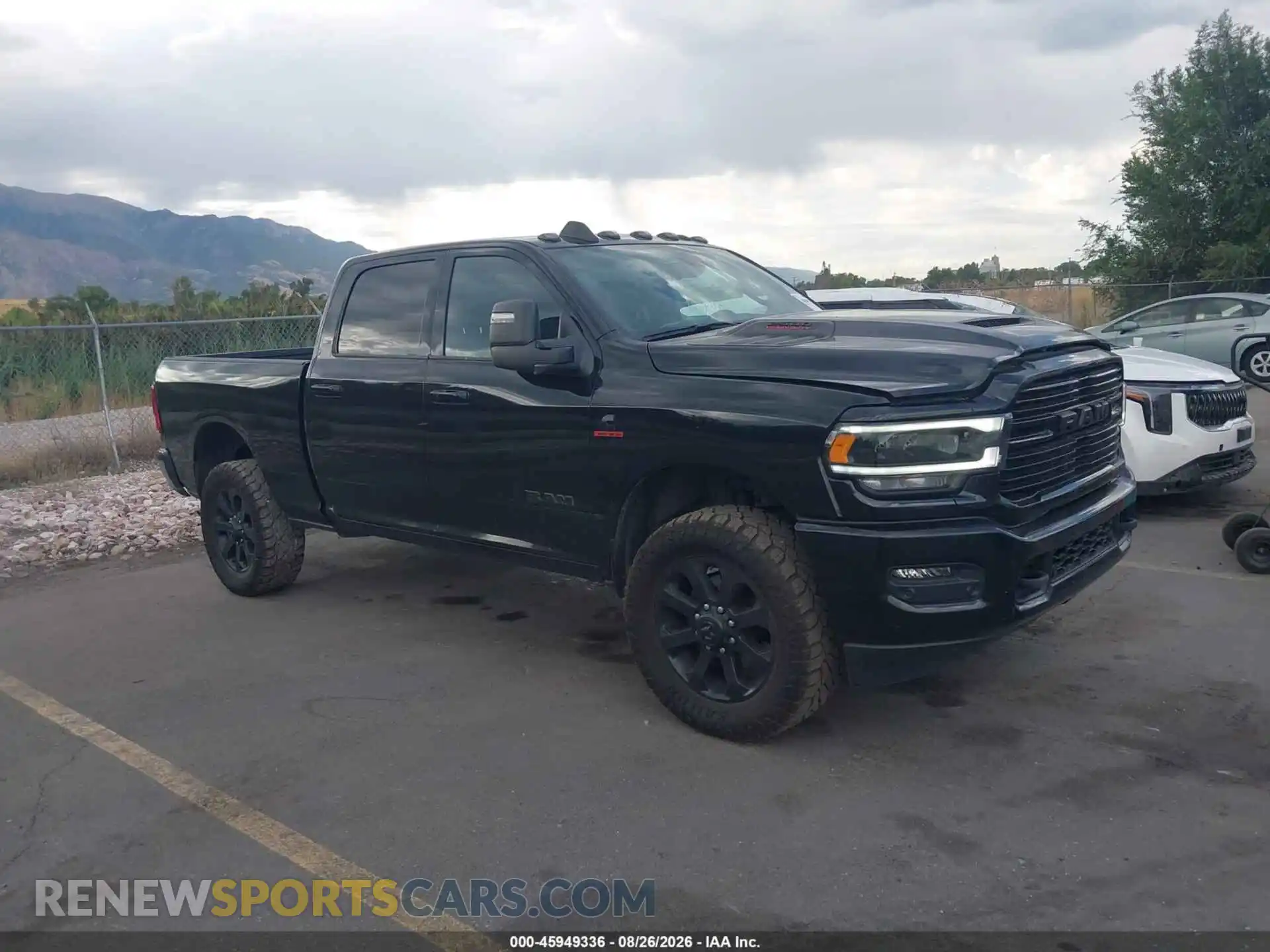 1 Photograph of a damaged car 3C6UR5FL2RG172052 RAM 2500 2024