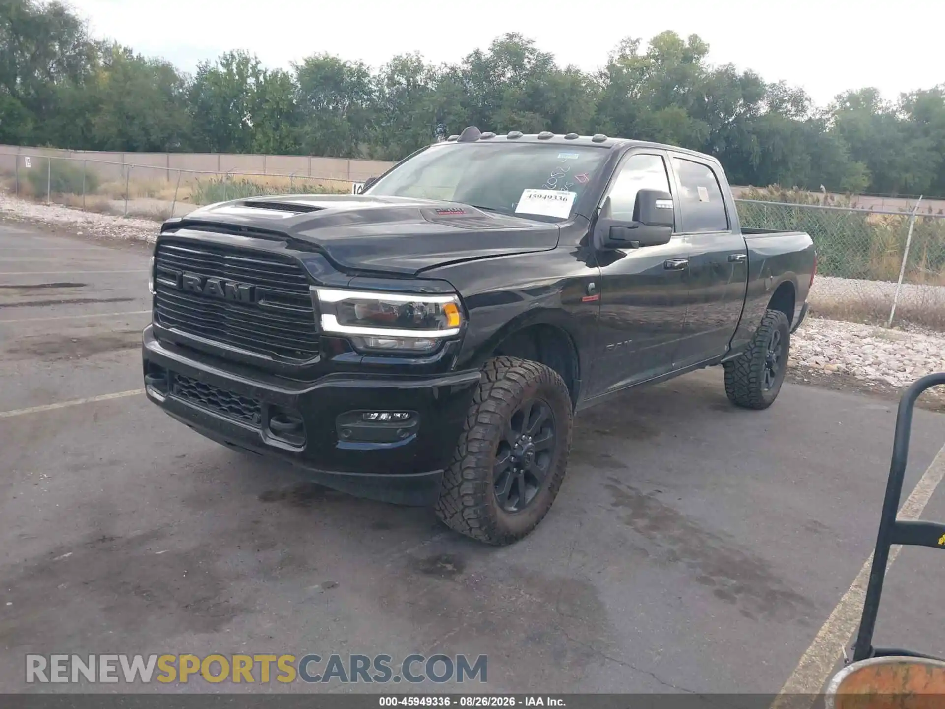 2 Photograph of a damaged car 3C6UR5FL2RG172052 RAM 2500 2024