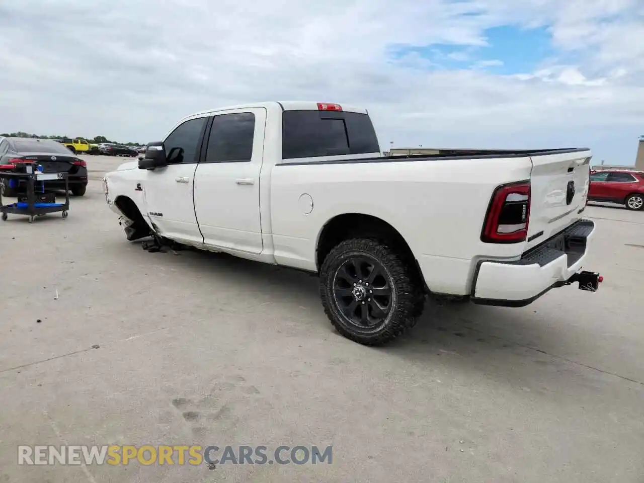 2 Photograph of a damaged car 3C6UR5FL5RG163118 RAM 2500 2024