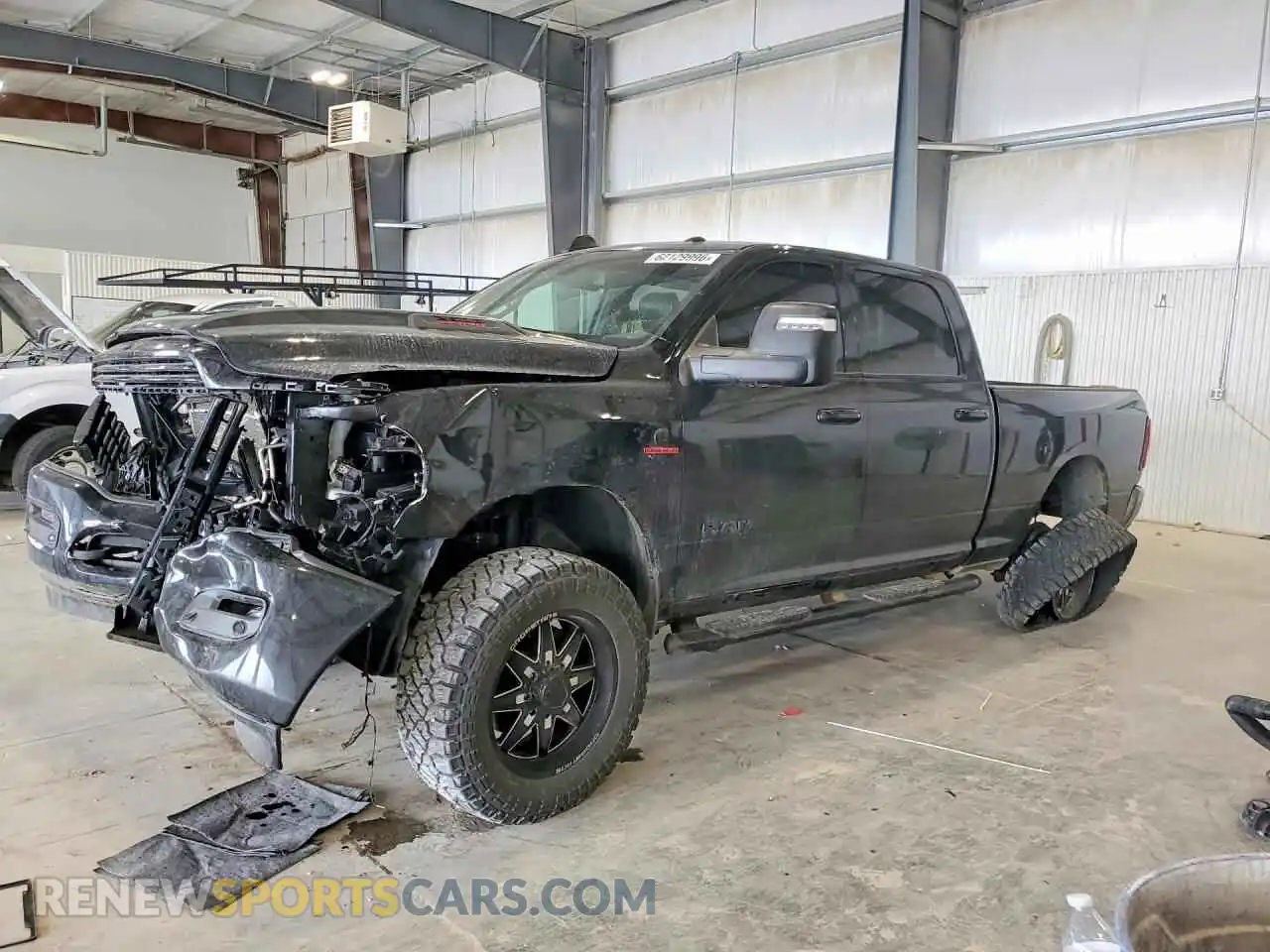 1 Photograph of a damaged car 3C6UR5FL6RG141709 RAM 2500 2024