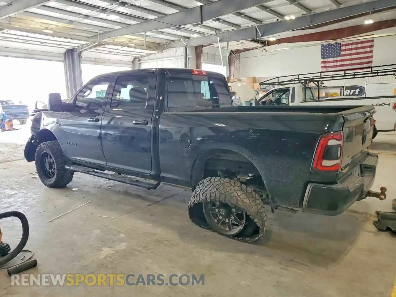 2 Photograph of a damaged car 3C6UR5FL6RG141709 RAM 2500 2024
