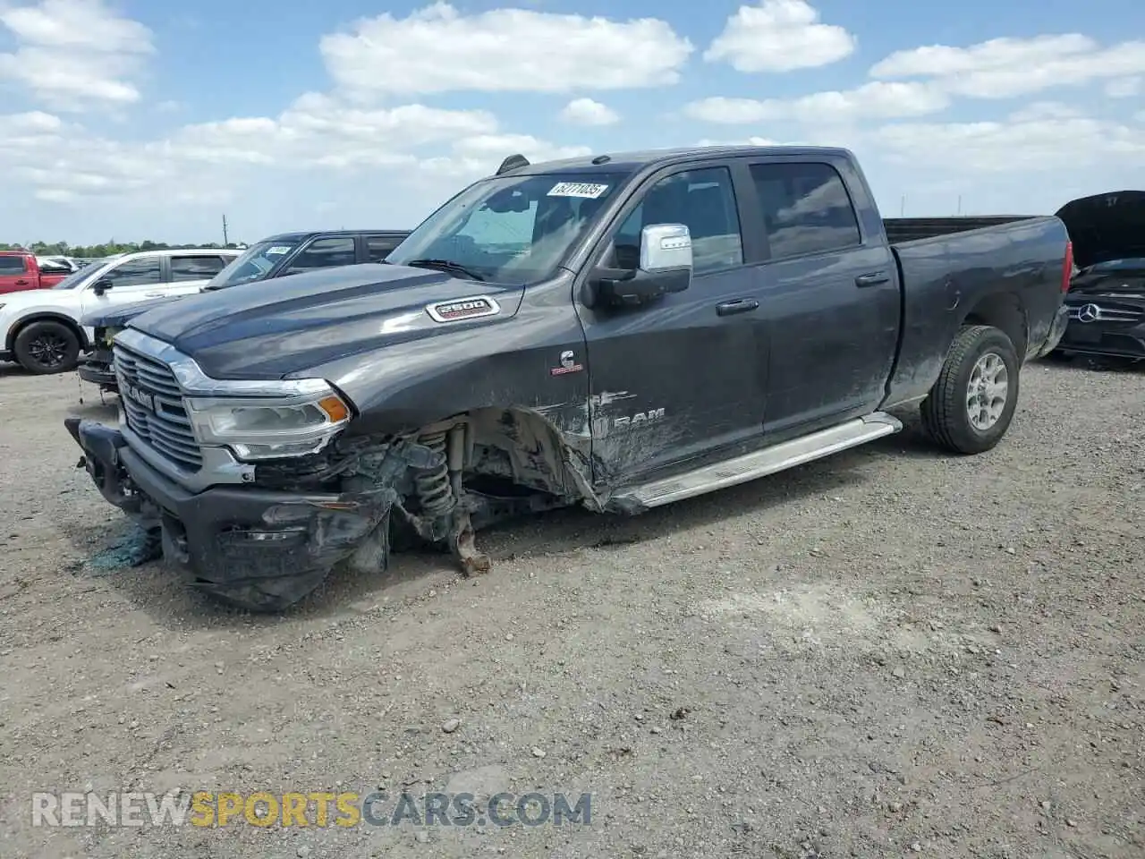 1 Photograph of a damaged car 3C6UR5FL6RG159952 RAM 2500 2024