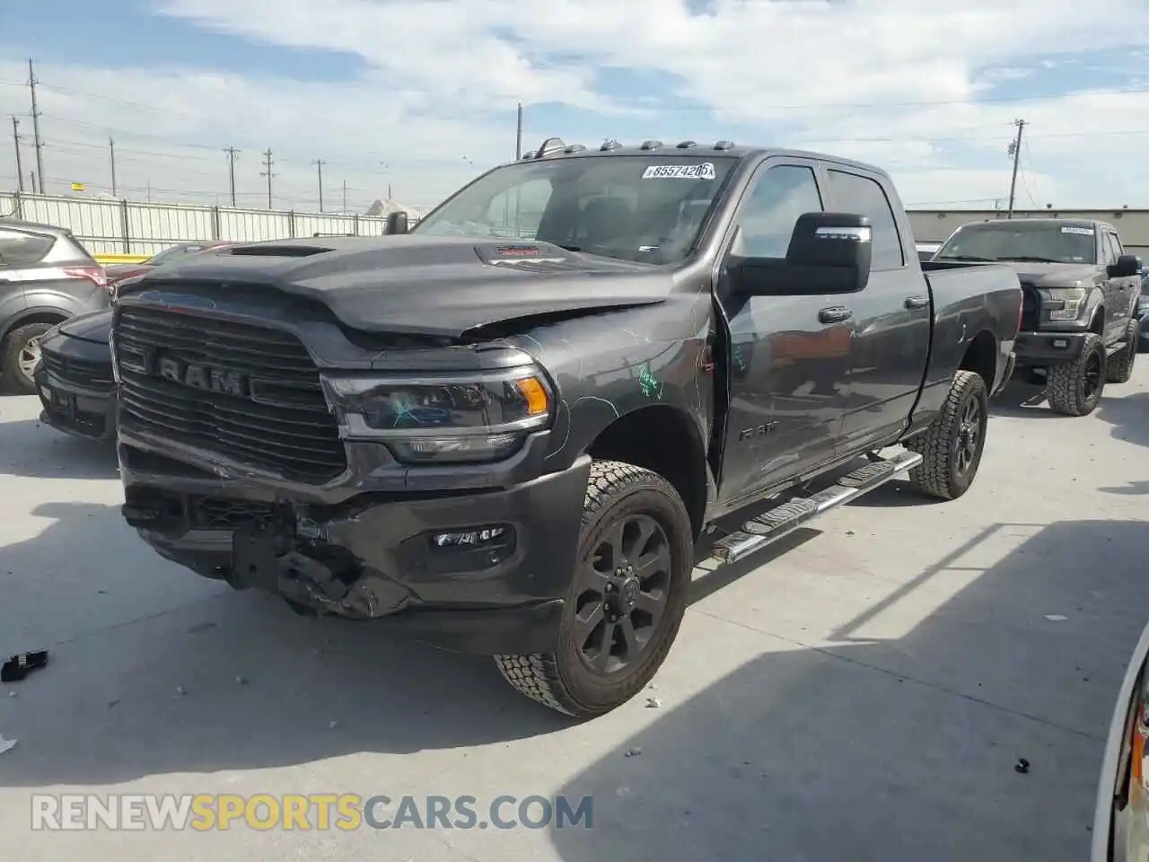 1 Photograph of a damaged car 3C6UR5FL9RG104279 RAM 2500 2024