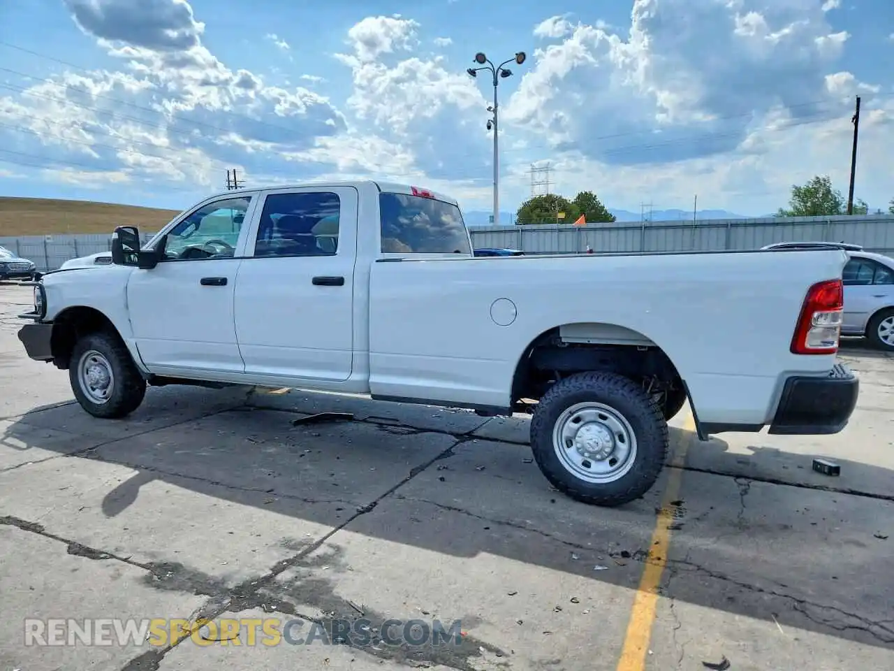 2 Photograph of a damaged car 3C6UR5HJ6RG173796 RAM 2500 2024