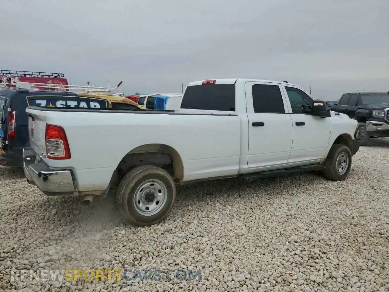 3 Photograph of a damaged car 3C6UR5HJ7RG139575 RAM 2500 2024