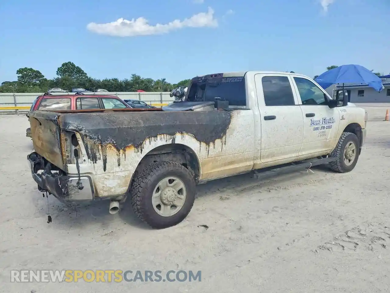 3 Photograph of a damaged car 3C6UR5HL2RG355710 RAM 2500 2024