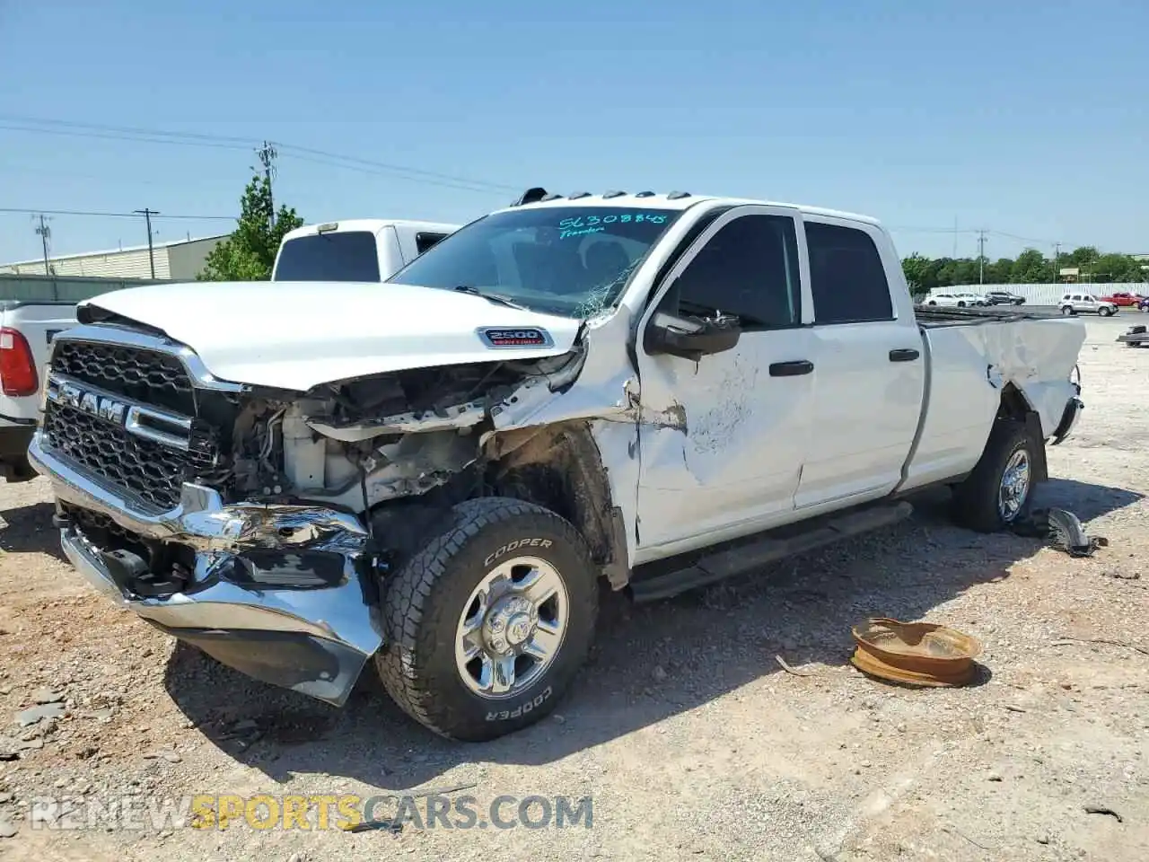 1 Photograph of a damaged car 3C6UR5HL9RG141202 RAM 2500 2024