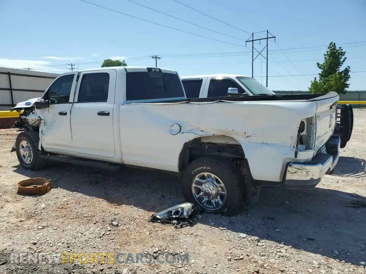 2 Photograph of a damaged car 3C6UR5HL9RG141202 RAM 2500 2024