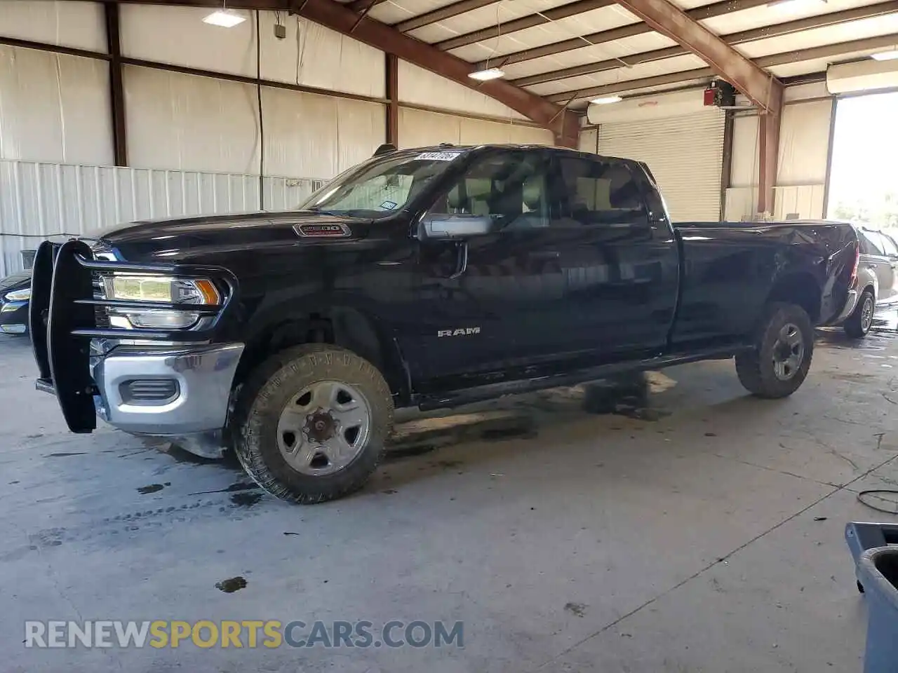 1 Photograph of a damaged car 3C6UR5JJ3RG193093 RAM 2500 2024